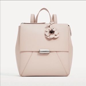 Backpack with Flowers Pendant Detail